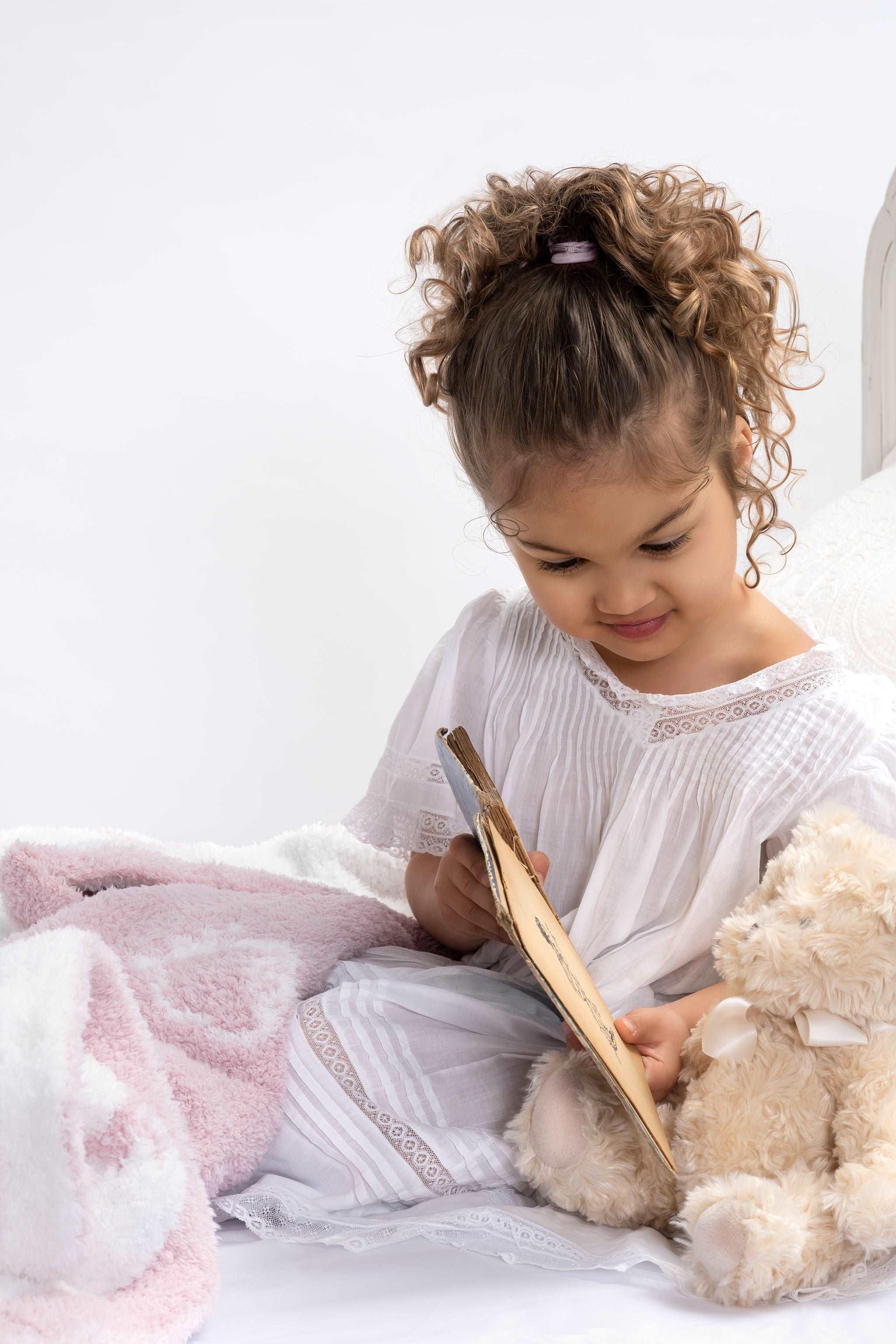 Little Girl with Teddy Bear Snuggling in a Strawberry Milkshake Rose Pink and Cream Throw Blanket